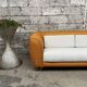 Canapé vintage en rotin design 1970 tissu bouclette écru