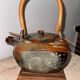 Ceramic teapots with bamboo handles by Elisabeth Wallet