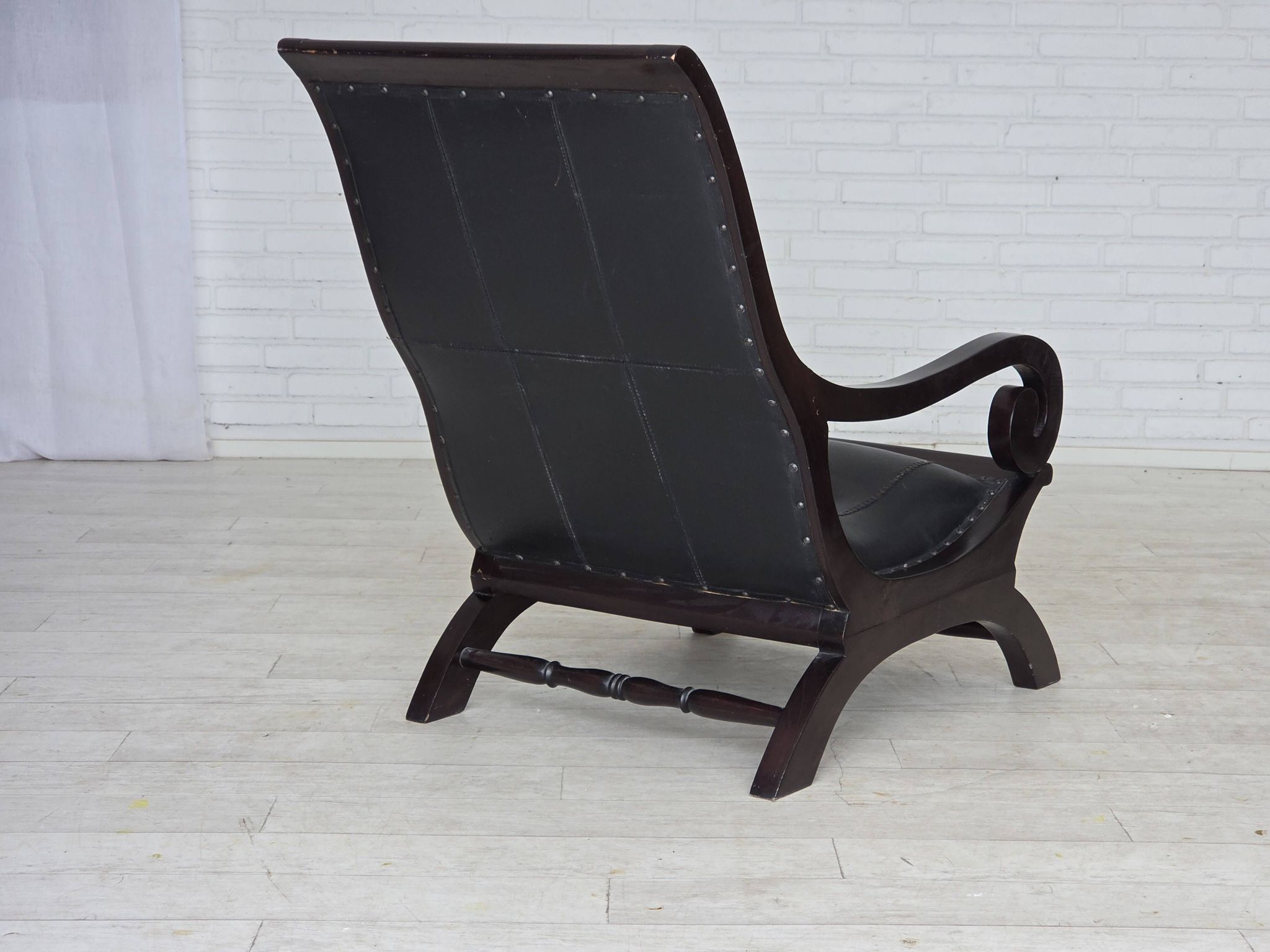 1970s, vintage armchair with footstool, black furniture leather.