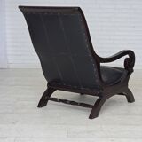 1970s, vintage armchair with footstool, black furniture leather.