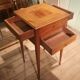 Nightstand with veneer and 4 drawers.