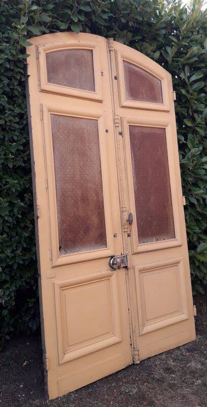 19th century double arched entrance door in oak with grilles and old glass