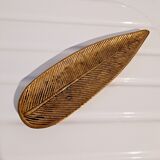 Empty brass leaf pocket