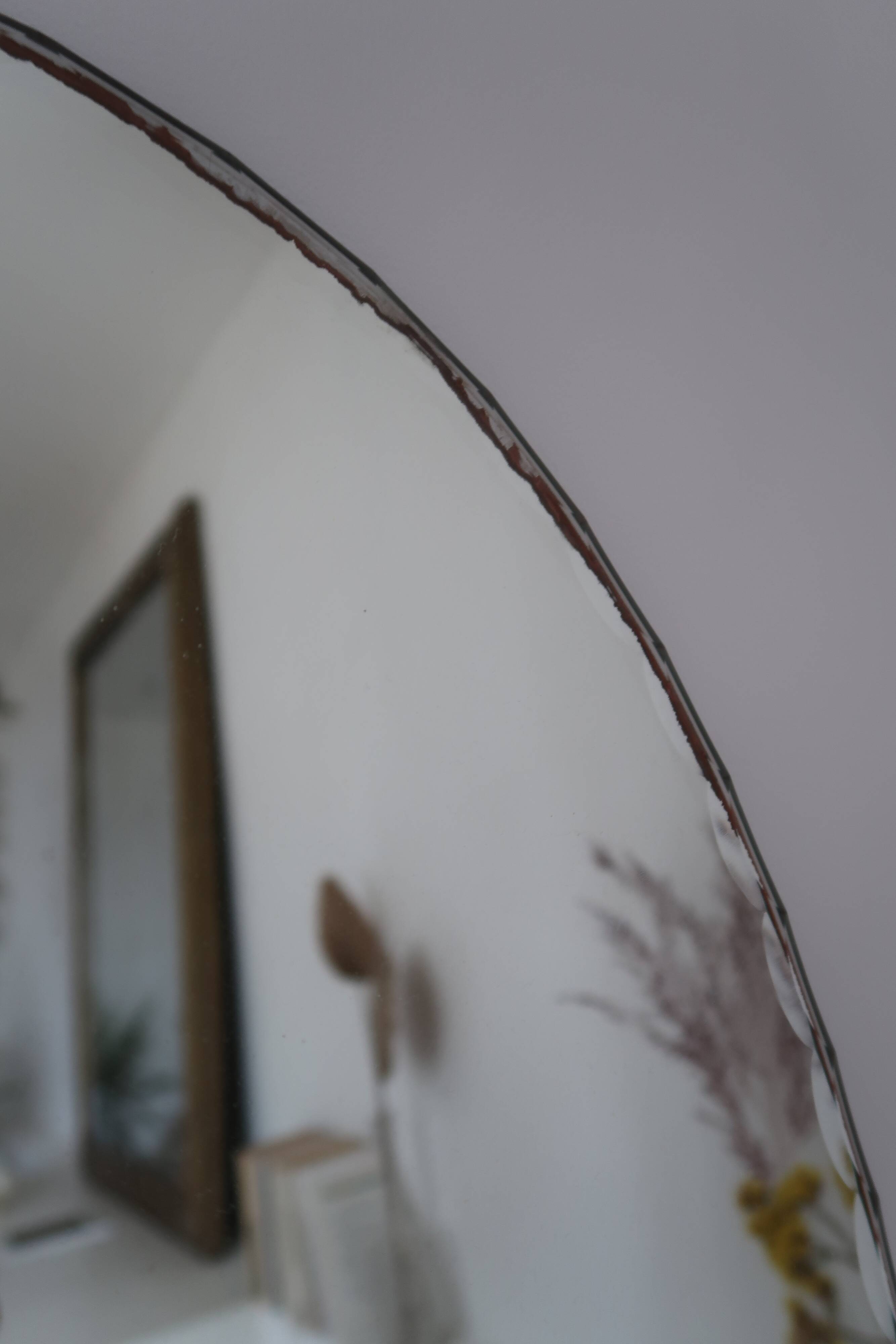 Vintage bevelled oval mirror