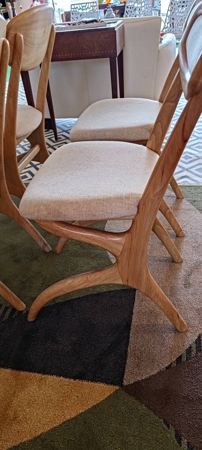 Four Scandinavian-style chairs