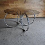 Vintage tubular coffee table in chrome with a transparent glass top, Mid-Century style 1960s.