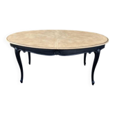 Oval table with integrated extension