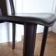 Set of 6 wooden chairs covered in leather.