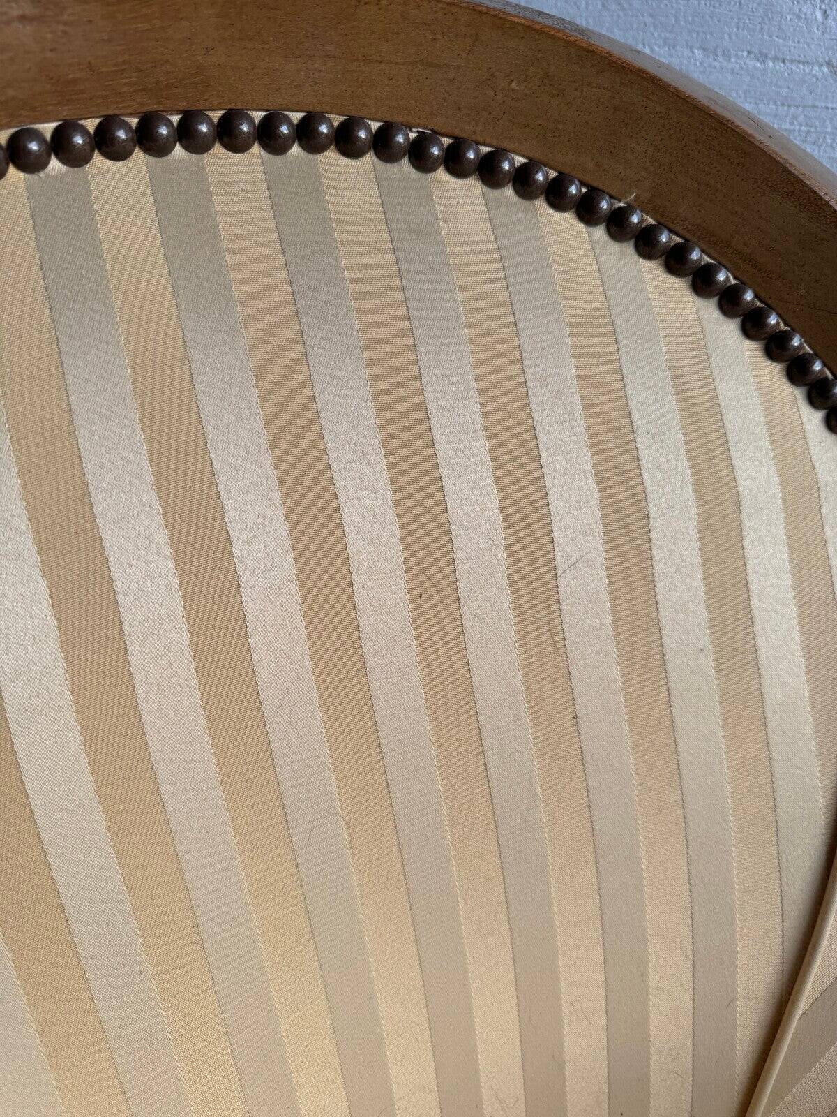 DeCoene antique wood writing desk with beige striped upholstered chair, brass-accented classic set