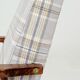 Vintage armchair and beige blue tartan footrest modern design