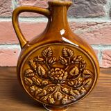 German round vase with floral motif, ornamental brown ceramic jug with handle