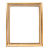 Large mirror in gold frame.