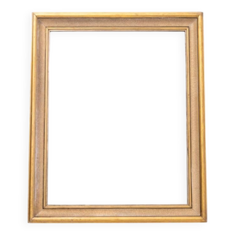 Large mirror in gold frame.