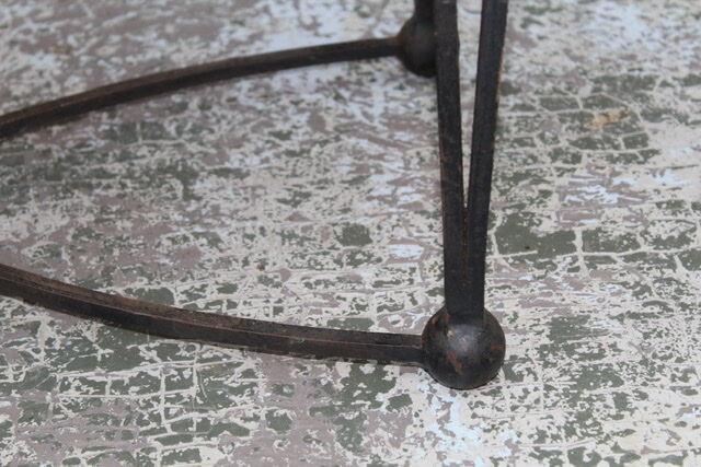 Black metal footing wooden coffee table