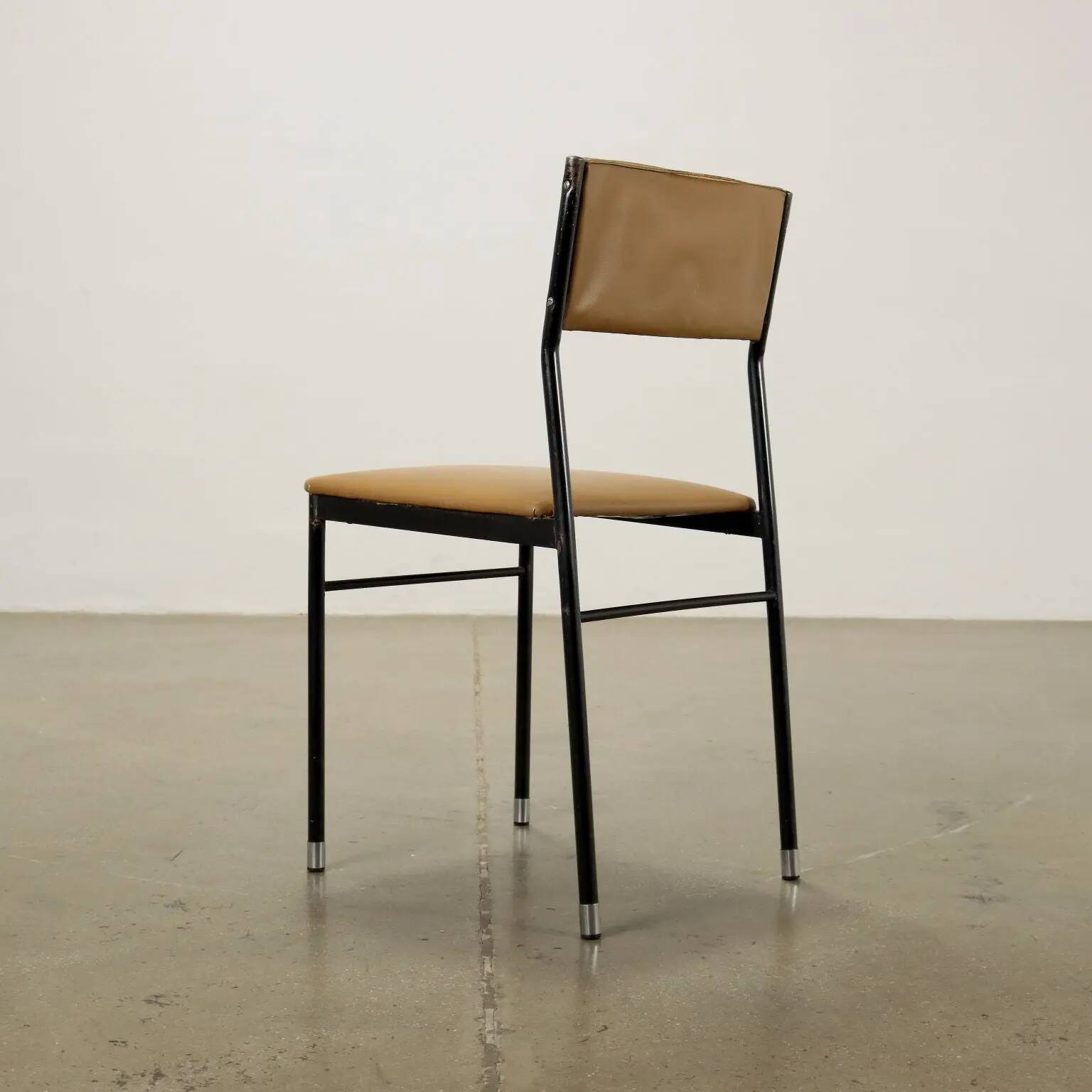 Vintage chairs from the 1960s in enamelled metal, faux leather and foam.