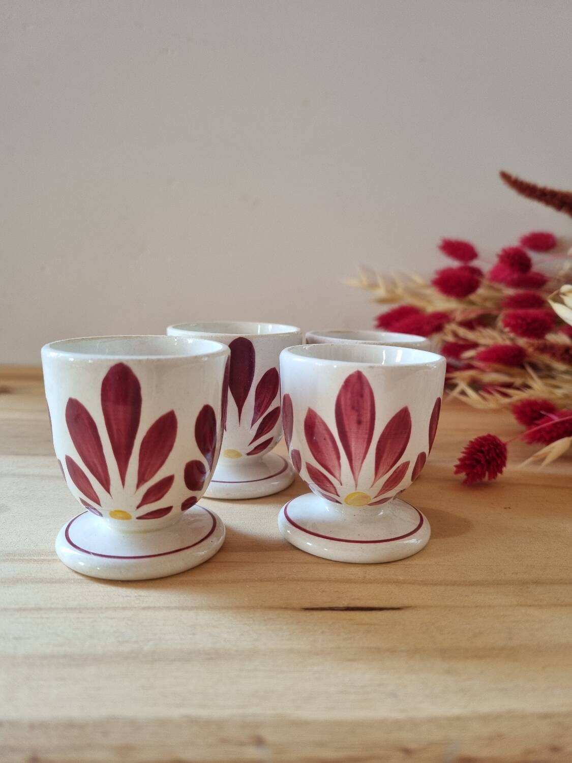 Set of four Digoin-style egg cups