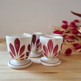 Set of four Digoin-style egg cups