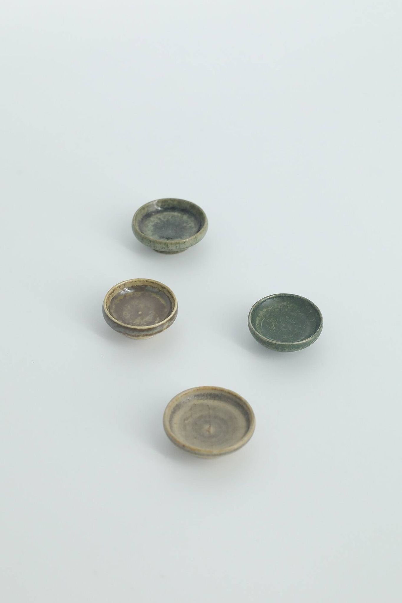 Set of 4 Scandinavian collection bowls in brown and green stoneware, mid-20th century.