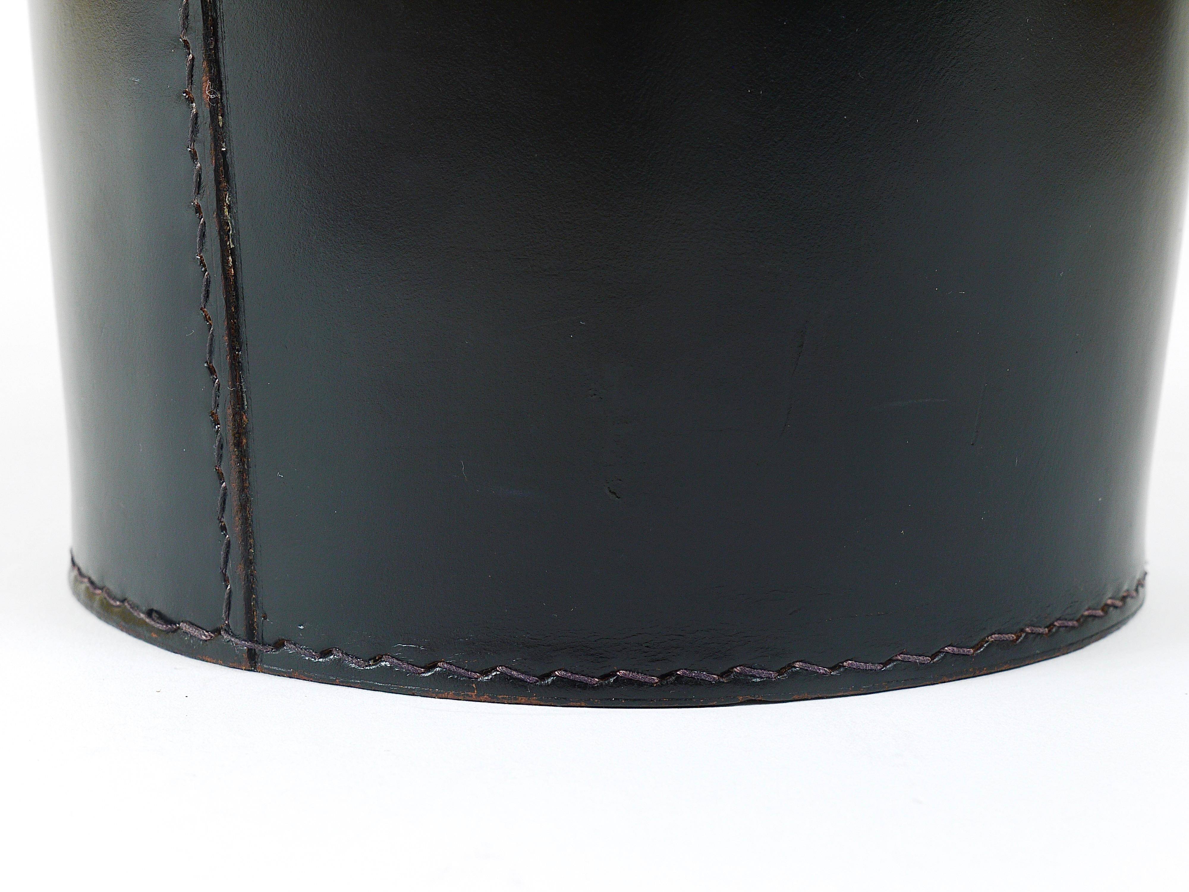 Mid-Century paper bin by Carl Auböck in black leather and brass, Austria, 1950s.