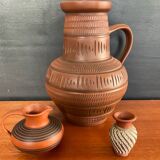 Trio of vintage vases in chiselled terracotta