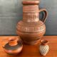 Trio of vintage vases in chiselled terracotta