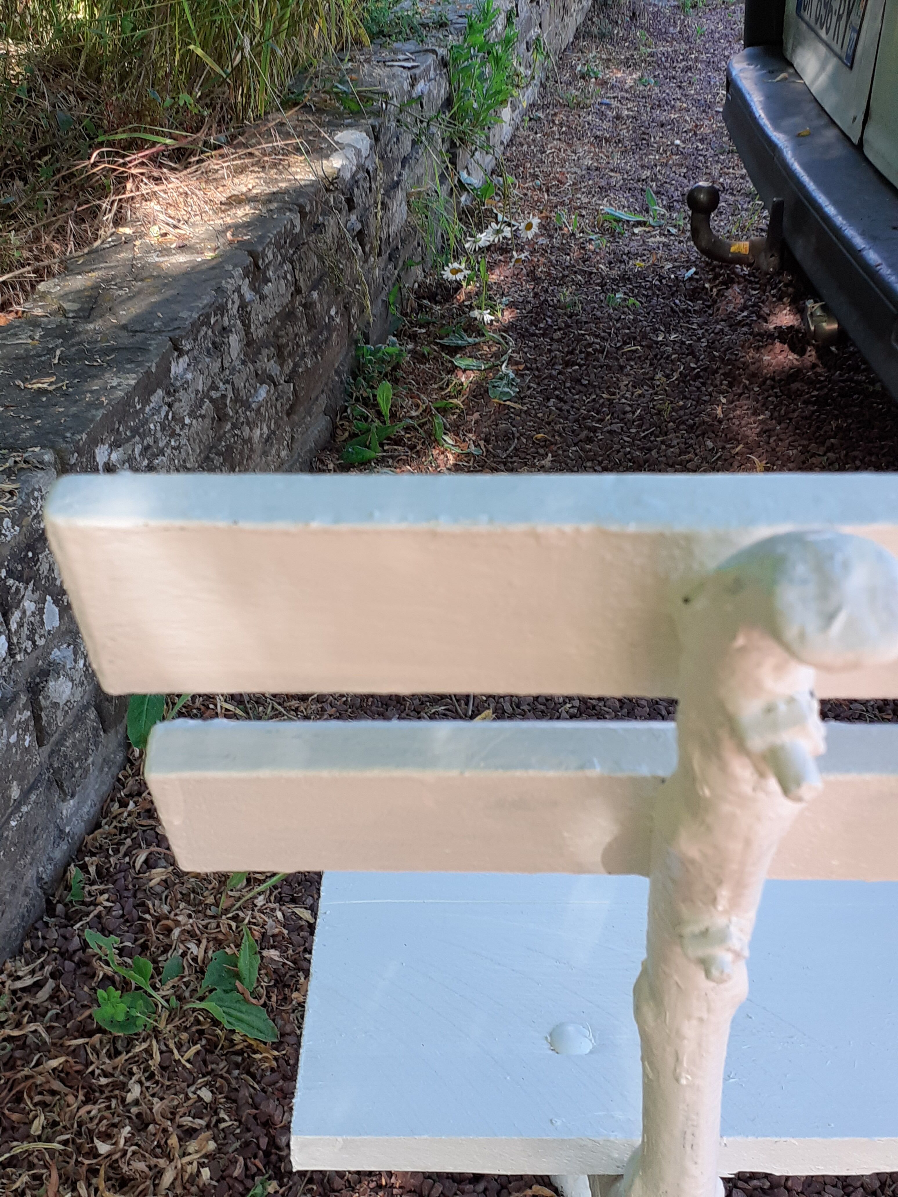 Old garden bench with cast iron feet and wooden planks