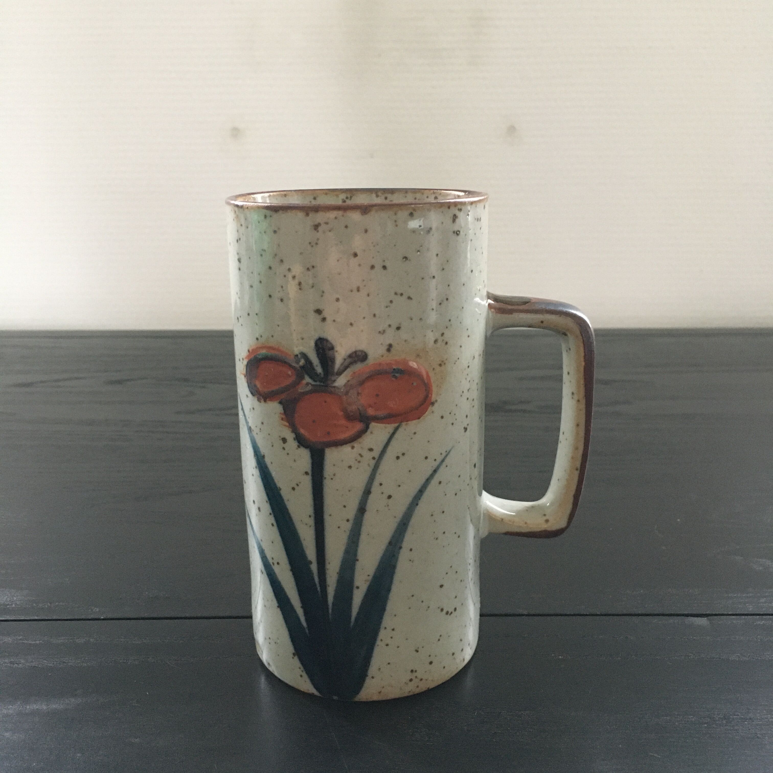 Stoneware mug with floral decoration