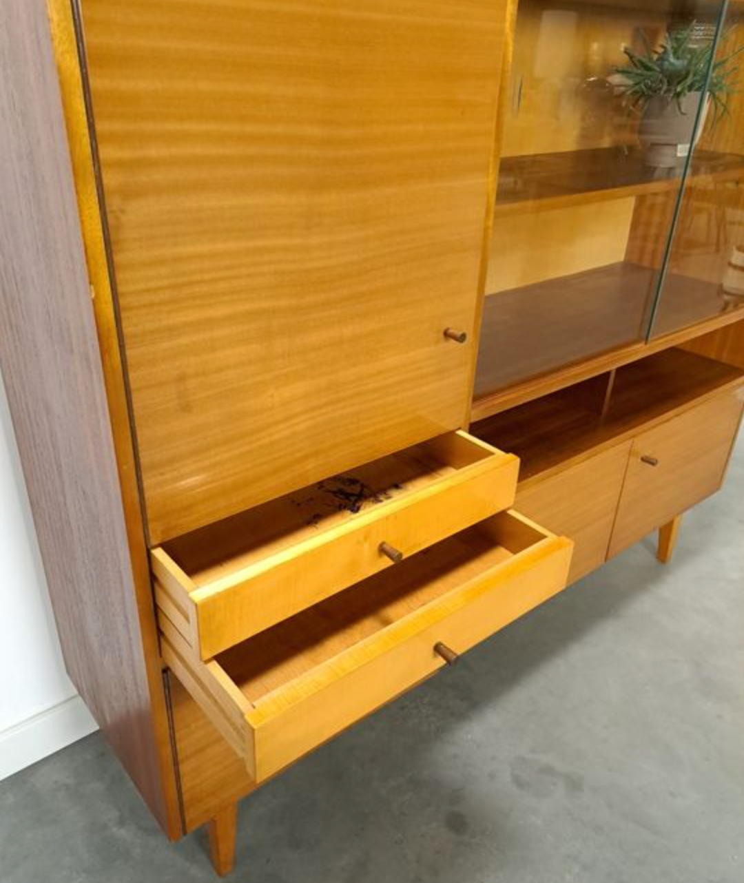 Vintage wooden sideboard with sliding glass doors and drawers