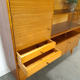 Vintage wooden sideboard with sliding glass doors and drawers