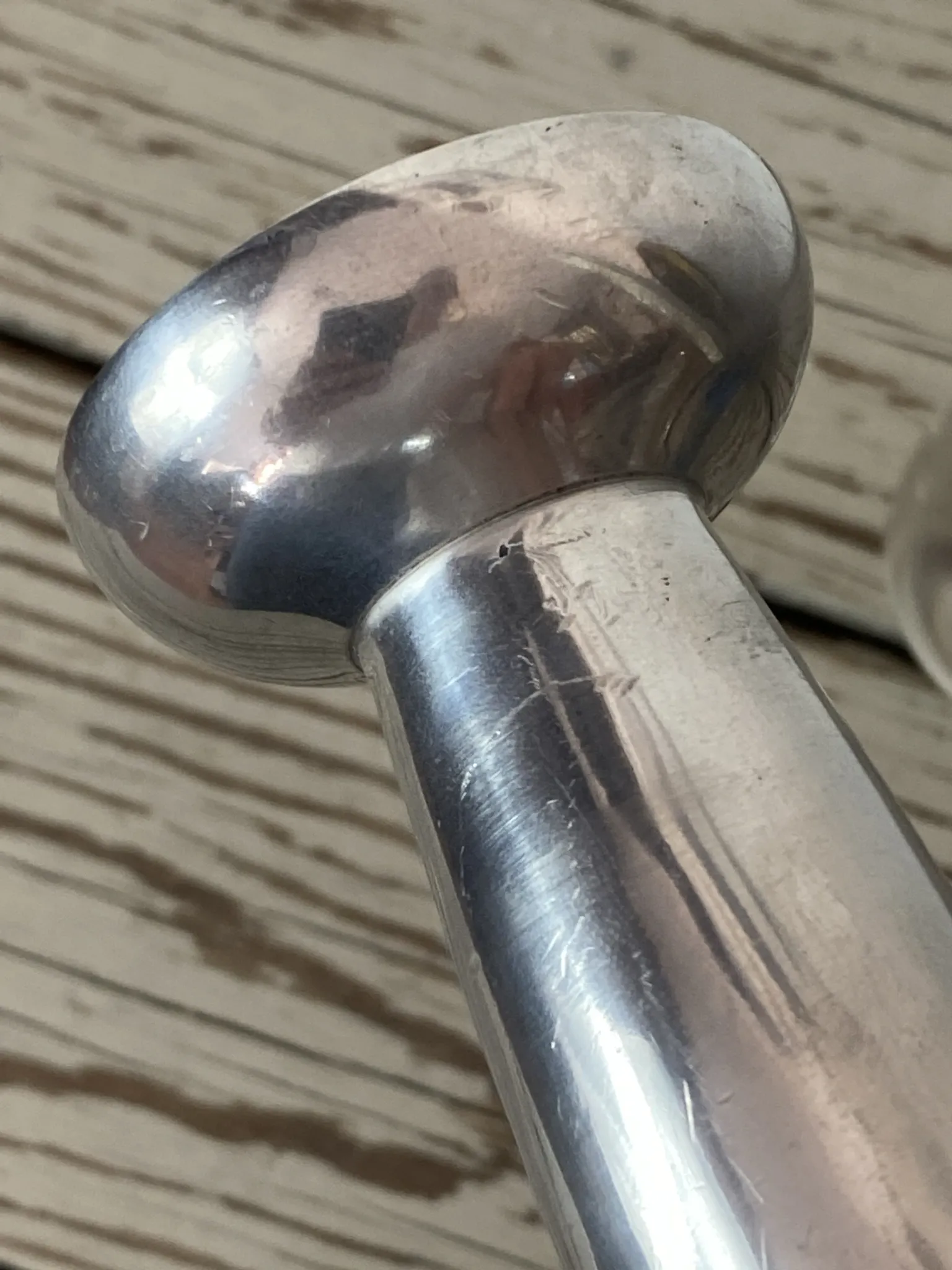 Pair of minimalist polished aluminium candle holders