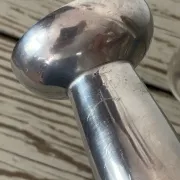 Pair of minimalist polished aluminium candle holders