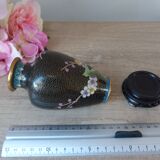 Small black cloisonné vase decorated with yellow and pink cherry blossoms, vase on wooden base