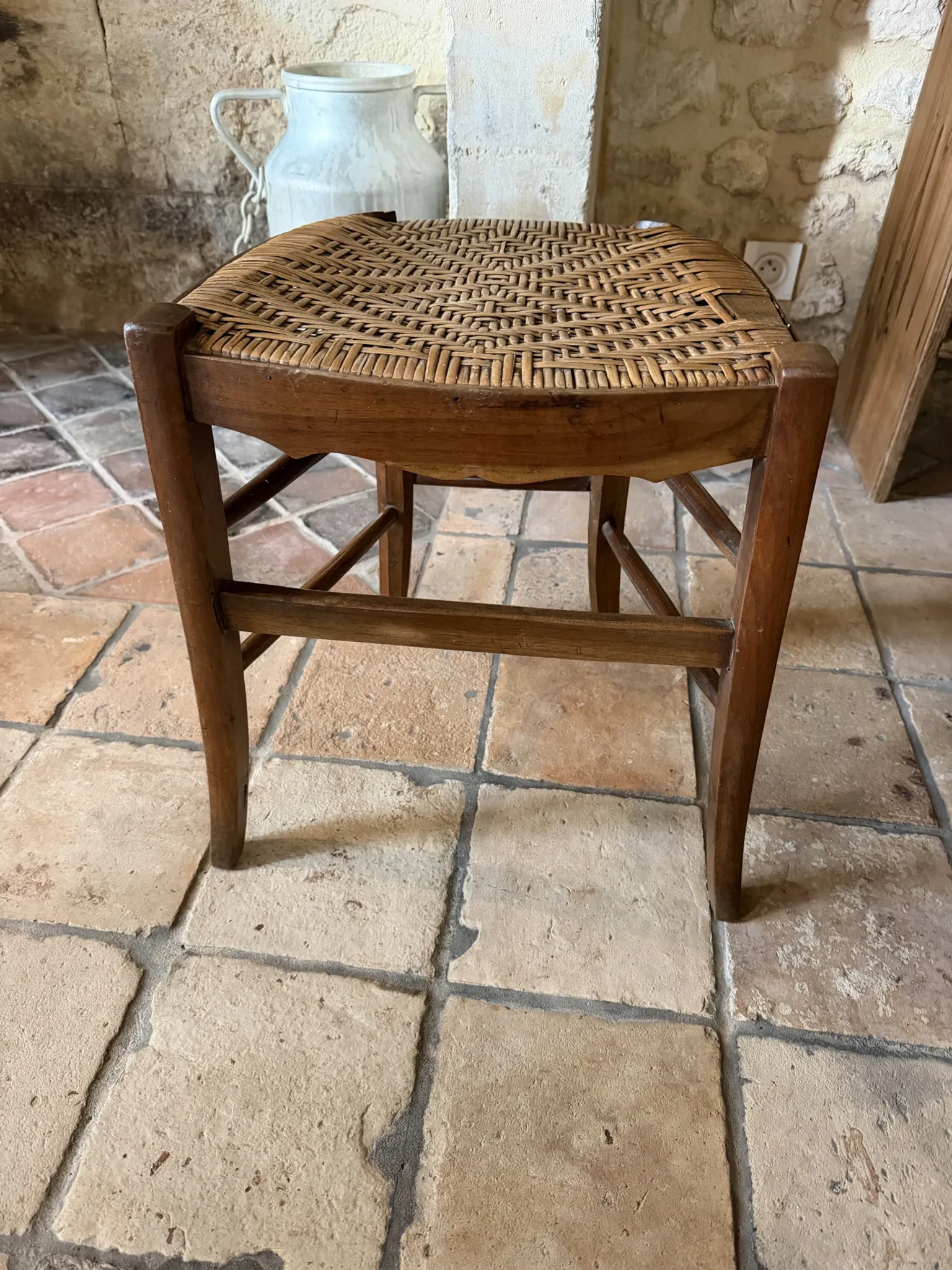 Campaign stool in rattan and wood