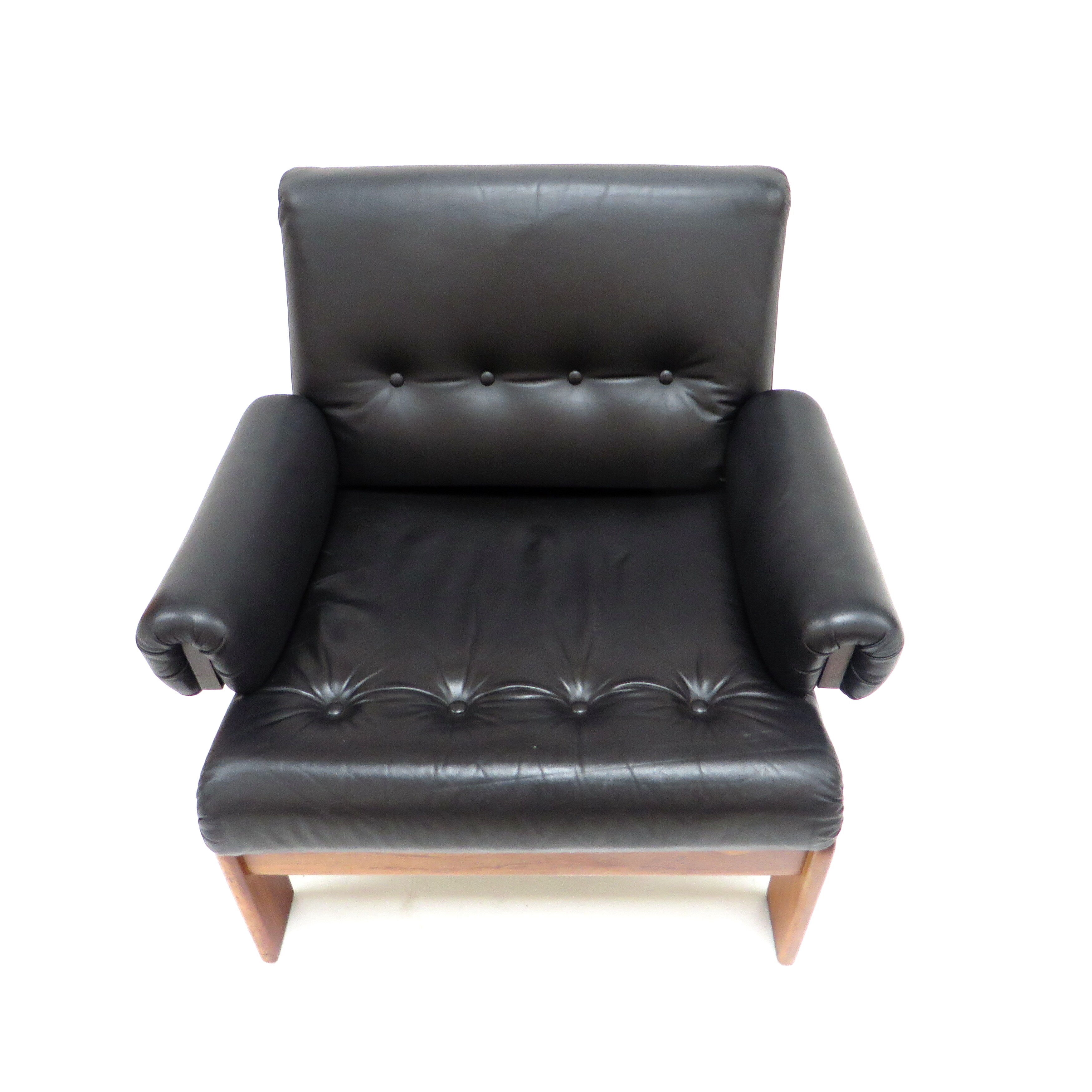 Vintage black leather armchair with solid rosewood frame made in the 1960s