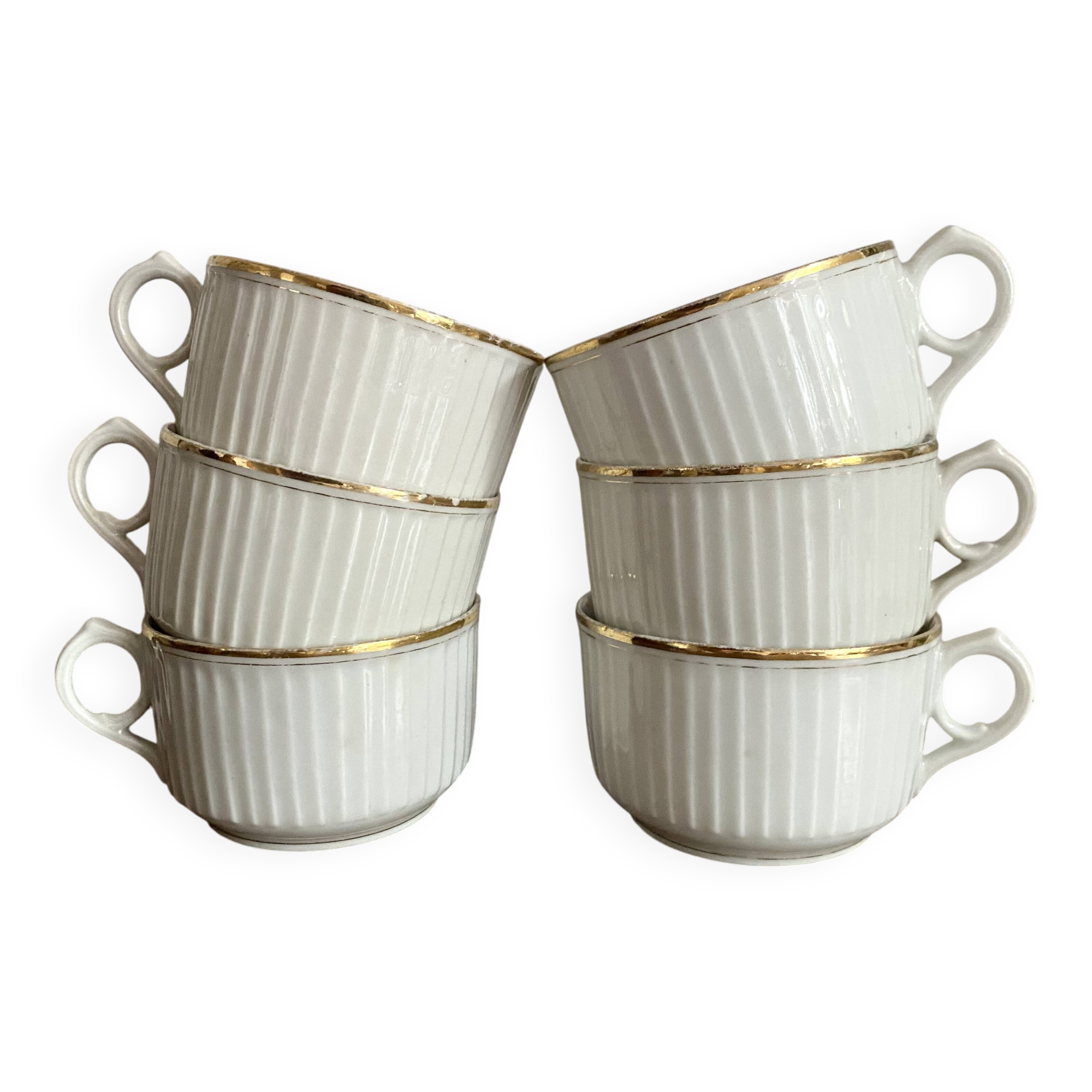 White and gold porcelain cups