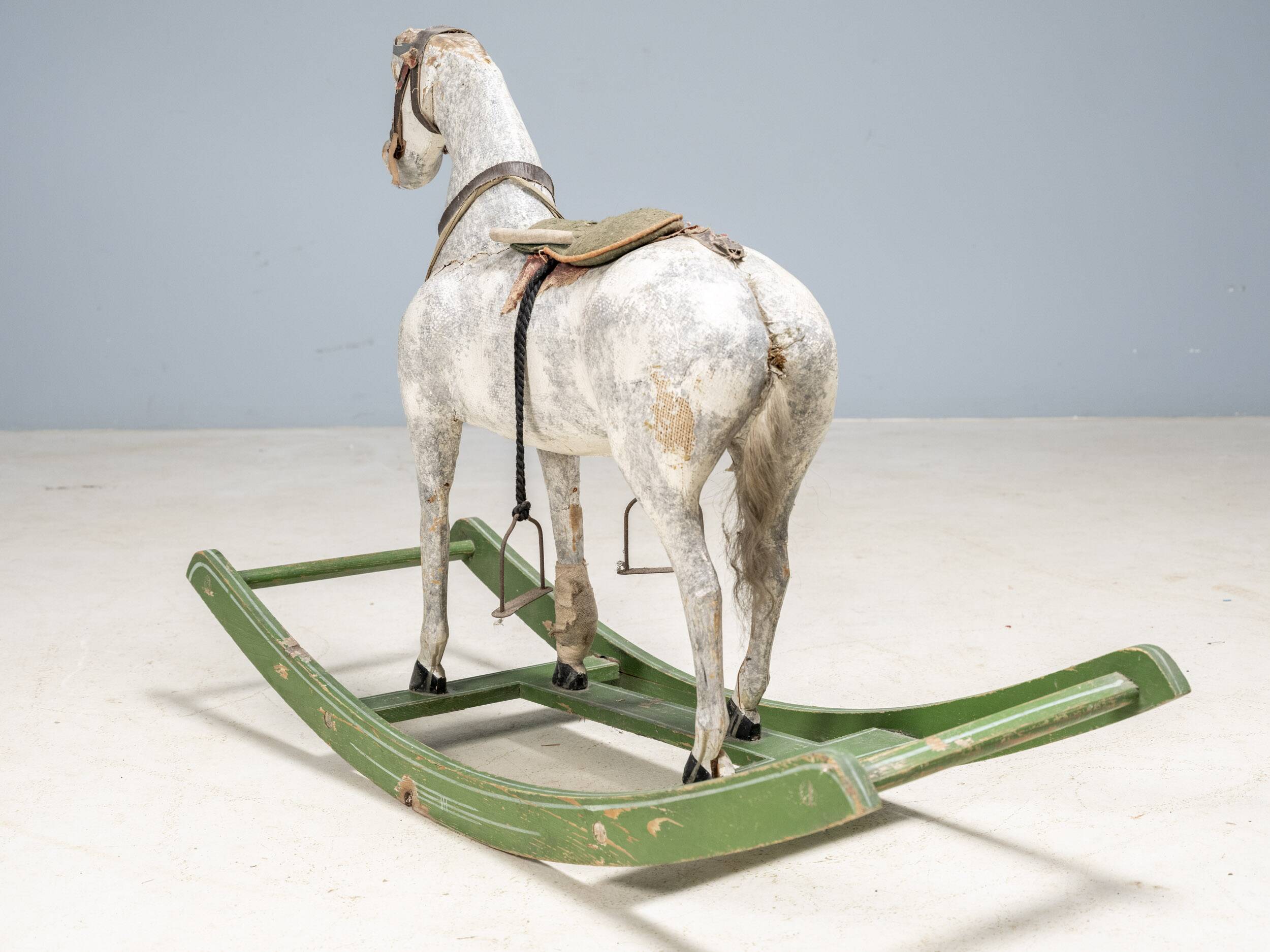 Antique wooden rocking horse, vintage toy with original patina.