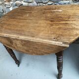 Round console table with folding shutters on copper wheels