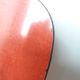 Chairs in red-orange formica and chrome metal.