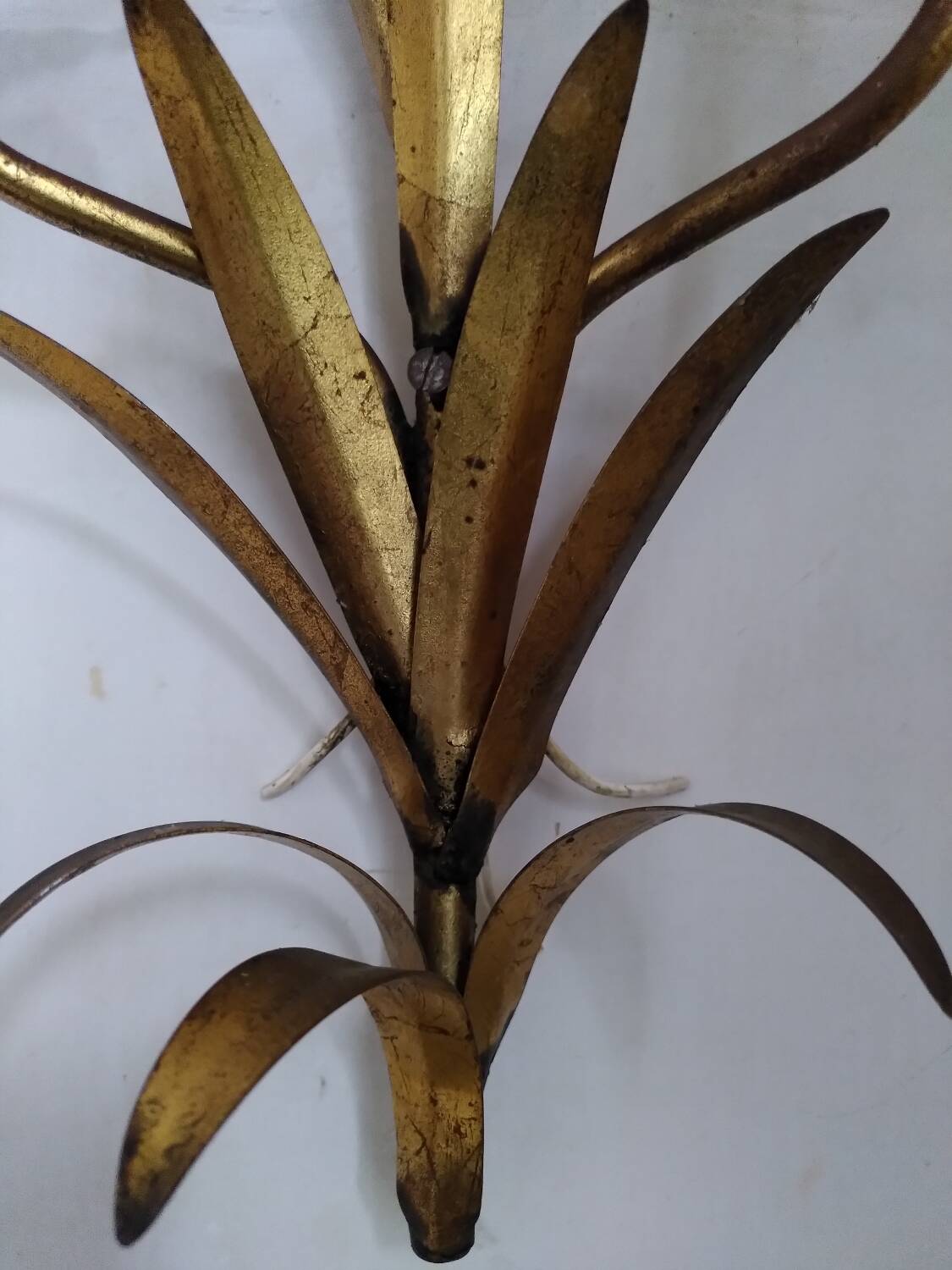 Pair of gold metal leaf wall sconces