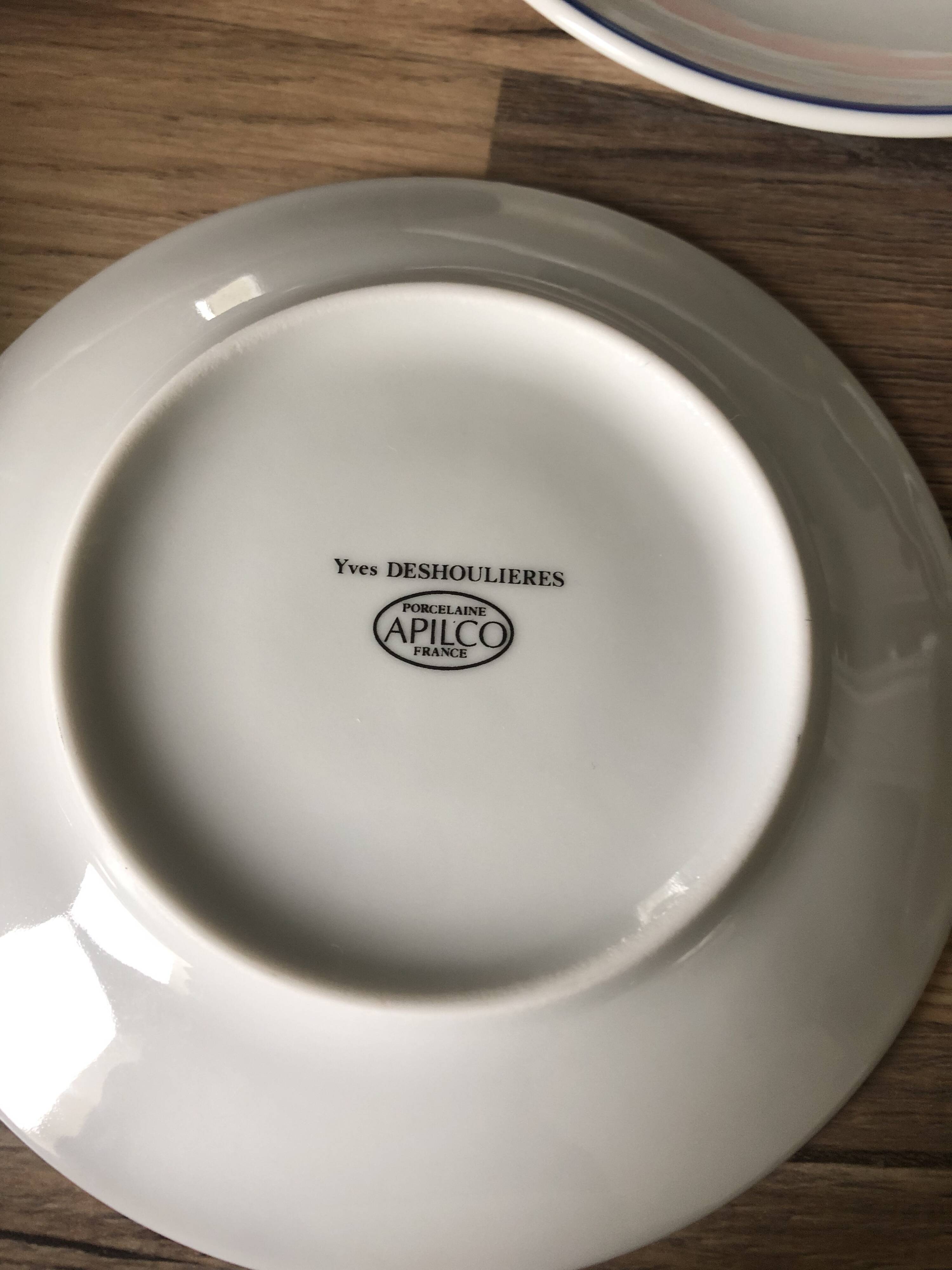 Set of 12 white porcelain saucers with blue edging