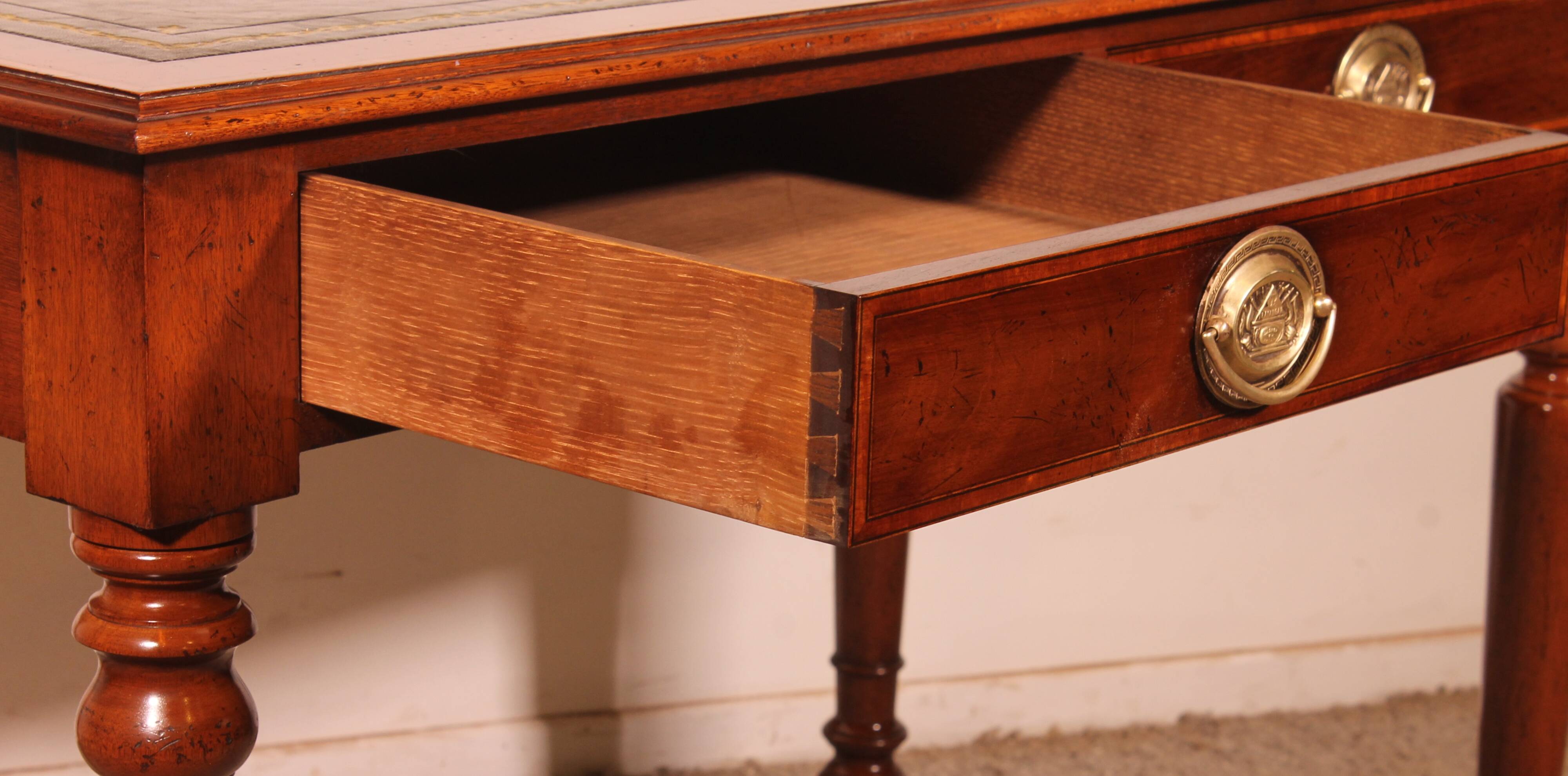 flat desk with two drawers from the 19th century in mahogany and inlays