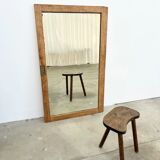 Antique mirror on an elm wardrobe door