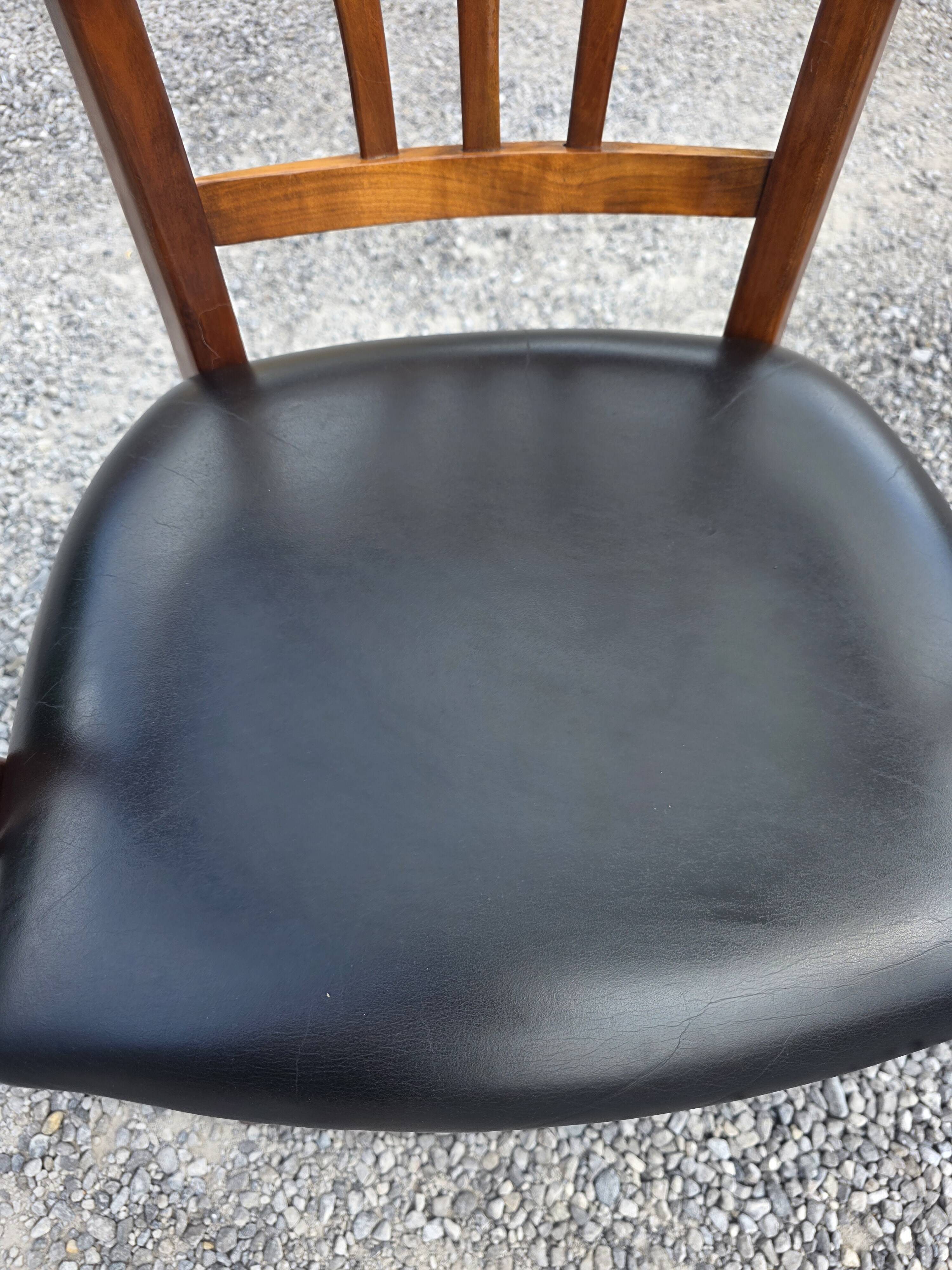 Mid-20th century solid cherry wood office chair.