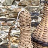 Glass bottles and rattan, woven wicker