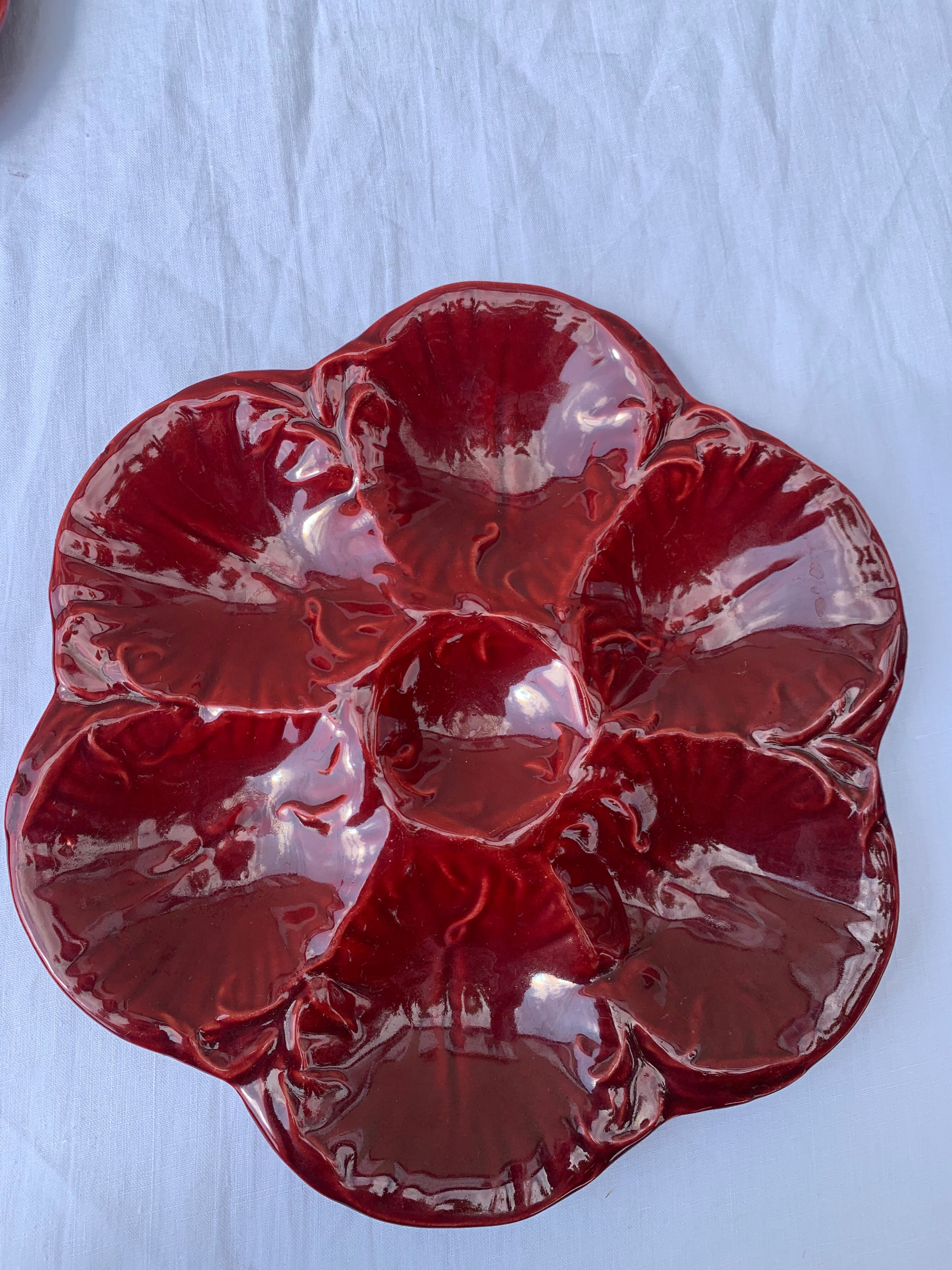 4 oyster plates in vintage red glazed ceramic slip and collector