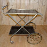 Rolling dessert in gold metal and trays in black formica