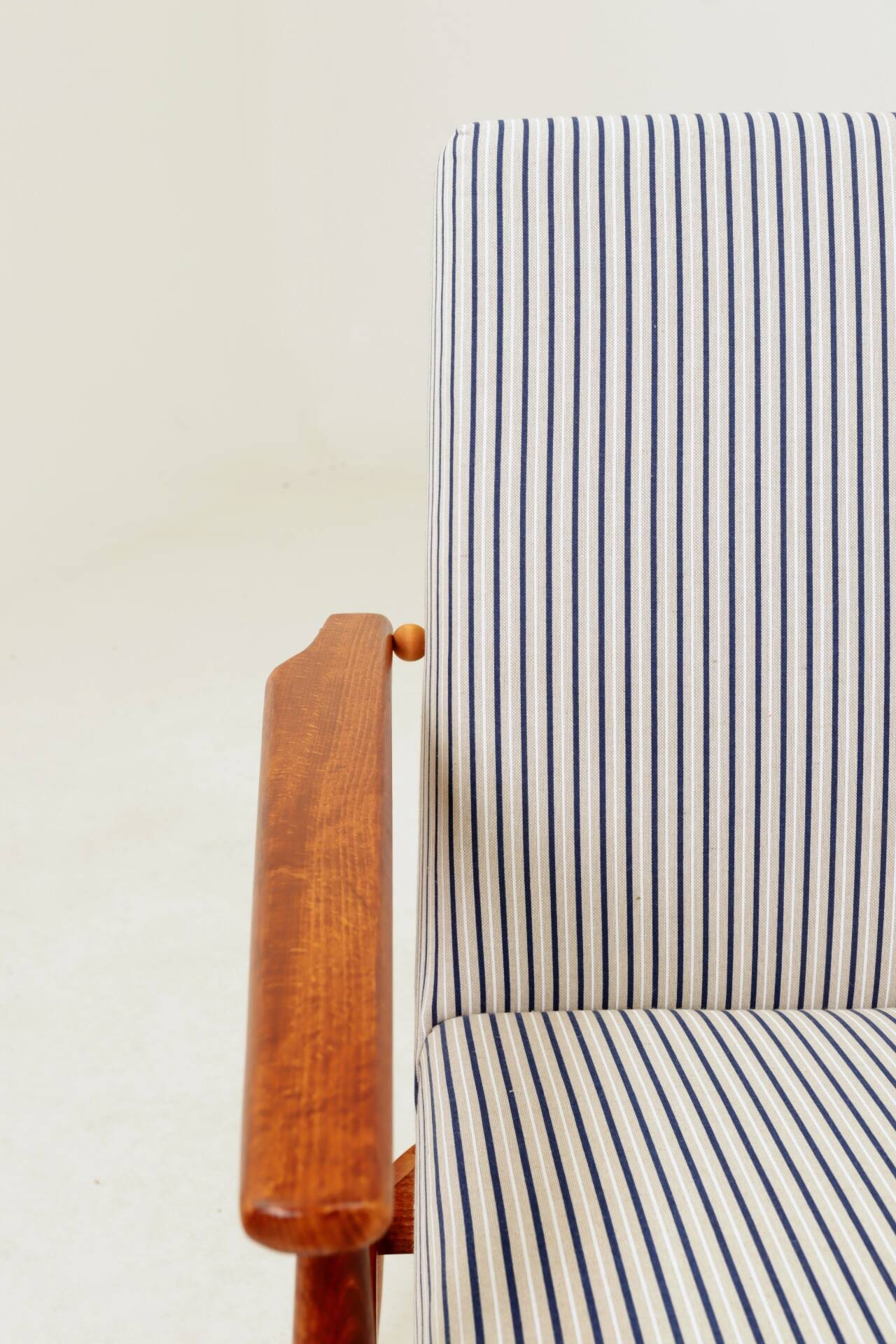Armchair with striped fabric footrest, 1960