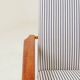 Armchair with striped fabric footrest, 1960