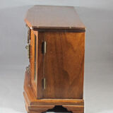 Wooden jewelry box in the shape of a chest of drawers