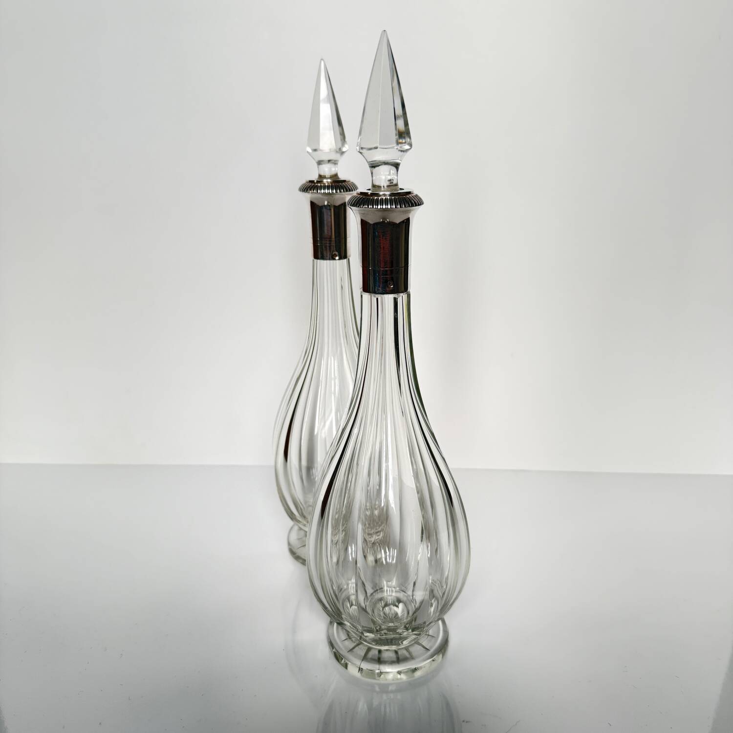 Pair of crystal decanters with solid silver mounts
